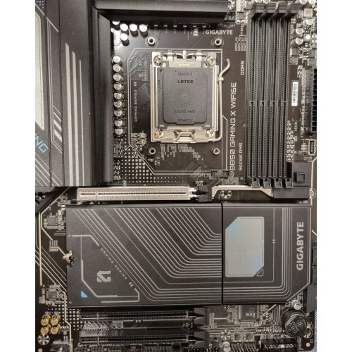 Уцінка материнська плата Gigabyte B850 GAMING X WIFI6E (sAM5, AMD B850) (Сліди використання, 871038) купити в Україні: Київ, Львів, Хмельницький, Тернопіль, Івано-Франківськ | Перевірка сумісності, низька ціна, відгуки, характеристики від TELEMART фото